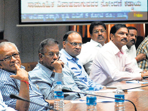 Money matters: FKCCI members watch the live telecast of the State Budget at the FKCCI hall in Bangalore on Friday. KPN