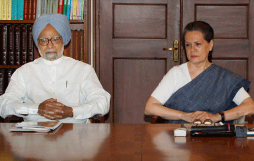Congress President Sonia Gandhi with Prime Minister Manmohan Singh during the meeting of Party Chief Ministers and state unit chiefs on Food Security roll out, at 10 Janpath in New Delhi on Saturday. PTI Photo