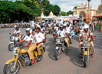 Heady matter: Cops take out  a two-wheeler rally to create awareness on helmets, in Mysore, on Saturday. dh photo