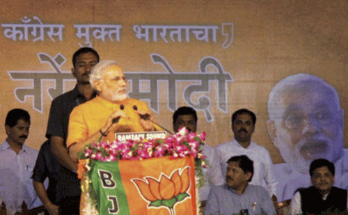Gujarat Chief Minister Narendra Modi addresses students at Fergusson College in Pune on Sunday. PTI Photo