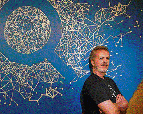 Lars Rasmussen, the engineering director of the Graph Search project, poses before a chart in Menlo Park, California. NYT