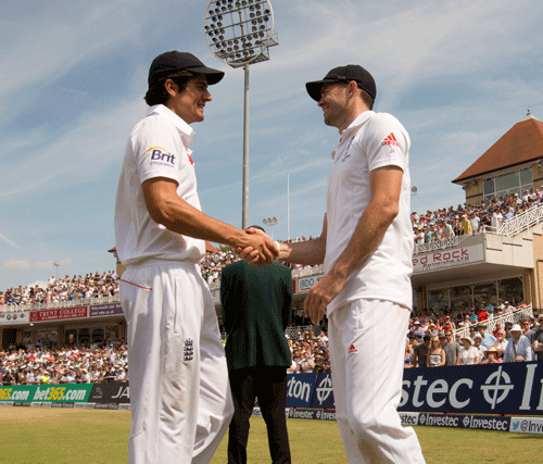 England captain Alastair Cook, left, shakes hands with man of the match James Anderson after the side's 14 run victory over Australia on the final day of the opening Ashes series cricket match at Trent Bridge cricket ground, Nottingham, England, Sunday, July 14, 2013. Anderson took 10 wickets in the match including the last, that of Brad Haddin for 71. AP Photo