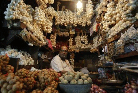 A vendor waits for customers at his stall at a wholesale food market in Mumbai June 17, 2013.  Credit: Reuters/