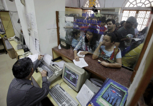 People sending telegrams in New Delhi on the last day of service on Sunday. The 163-year old telegram service in the country - the harbinger of good and bad news for generations of Indians - ends on Sunday. PTI Photo
