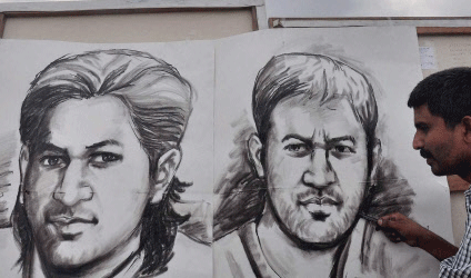 An artist makes sketches of Mahendra Singh Dhoni on his 32nd birthday in Moradabad. PTI Photo
