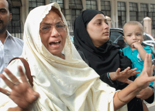 Convicted spy Javed Mozawala's wife & mother reacting to his conviction outside a court in Mumbai on Monday. PTI Photo