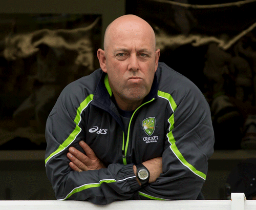 Australia's coach Darren Lehmann stands on the balcony of the players dressing room before the first day of the opening Ashes series cricket match against England at Trent Bridge cricket ground, Nottingham, England, Wednesday, July 10, 2013. AP Photo