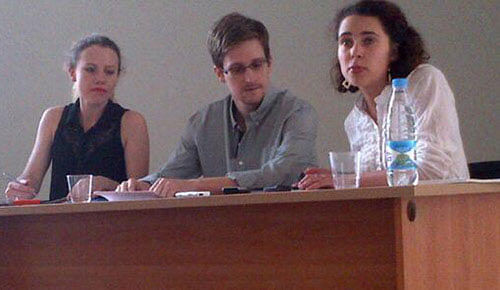 FILE - In this Friday, July 12, 2013 file photo originally made available by Human Rights Watch, SA leaker Edward Snowden attends a meeting with Russian activists and officials at Sheremetyevo airport, Moscow. Russia's state RIA Novosti news agency is quoting a Russian lawyer as saying that National Security Agency leaker Edward Snowden has asked for a temporary asylum in Russia. The agency quotes Anatoly Kucherena as saying that Snowden submitted the asylum request Tuesday, July 16, 2013 to Russia's Federal Migration Service. AP photo
