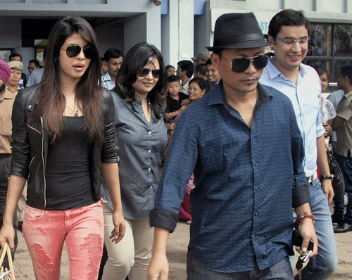 Bollywood actress Priyanka Chopra on her arrival at Imphal airport. Priyanka will meet Indian boxer Mary Kom to know about her life as she is playing the lead role in a film based on the boxer. PTI Photo