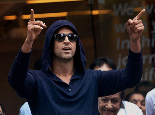 Bollywood star Hrithik Roshan gestures as he comes out of a hospital after undergoing a successful surgery for a clot in his brain, in Mumbai on Thursday. PTI Photo by Santosh Hirlekar