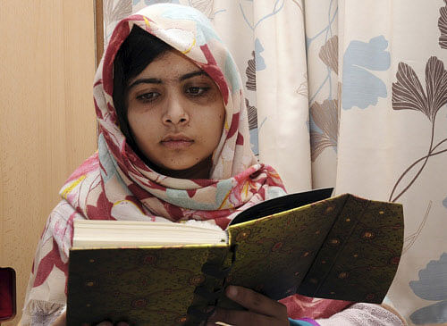 FILE - In this undated file photo provided by Queen Elizabeth Hospital in Birmingham, England, Malala Yousufzai, the 15-year-old girl who was shot at close range in the head by a Taliban gunman in Pakistan, reads a book. AP photo