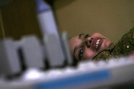 Shabnam, a surrogate mother, looks at gynaecologist Nayna Patel during an ultrasound examination of Shabnam in Patel's clinic in Anand in the western Gujarat. Reuters file photo