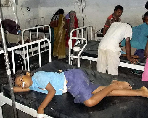 School children being treated at a hospital after they complained of sickness following mid-day meal at a village in Chapra district of Bihar. PTI Photo