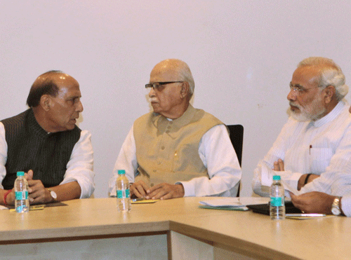 BJP President Rajnath Singh with Senior party leader L K Advani, Narendra Modi and Arun Jaitley during the party's Parliamentary Board Meeting in New Delhi on Thursday. PTI Photo