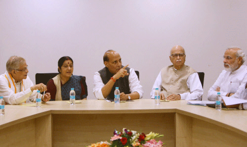 BJP President Rajnath Singh with senior party leader L K Advani, Murli Manohar Joshi, Sushma Swaraj and Narendra Modi during the party's Parliamentary Board Meeting in New Delhi on Thursday. PTI Photo