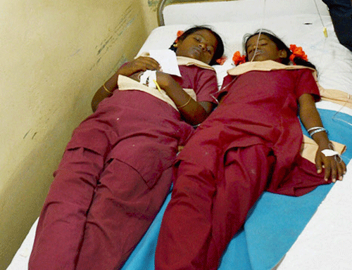Girls who fell ill after consuming mid-day meal being treated at a hospital in Neyveli on Thursday. PTI Photo