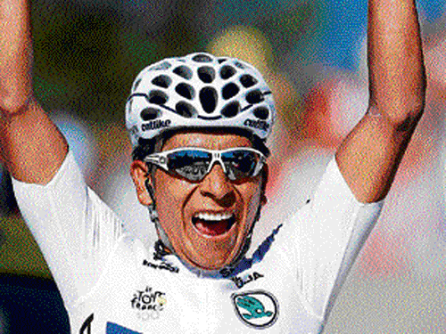 jubilant Colombian Nairo Quintana celebrates after winning the 20th stage of the Tour de France on Saturday. AP