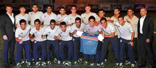 moment to remember: Bengaluru FC players pose with the team jersey during the unveiling ceremony at the Bangalore Football stadium. DH&#8200;PHOTO