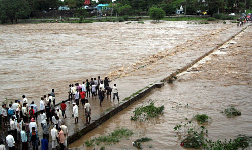 Submerged Pawnar River bridge following heavy rains at Wardha in Vidarbha on Saturday. PTI Photo