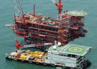 Reliance Industries KG-D6's control and raiser platform is seen off the Bay of Bengal in this undated handout photo. India's Reliance Industries Ltd resumed crude oil production from its east coast MA-1 field on March 8 following an emergency shutdown in December, Upstream Regulator V.K. Sibal said on March 12, 2009. REUTERS