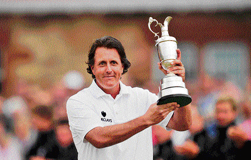 man of the moment: American Phil Mickelson poses with the Claret Jug after winning the British Open on Sunday. AFP