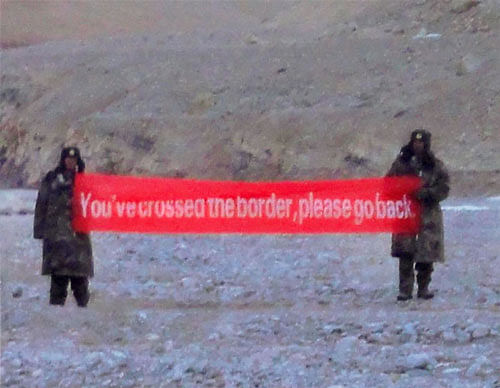 "YOU'VE CROSSED THE BORDER, PLEASE GO BACK' said a banner held aloft by intruding Chinese troops at Daulat Beg Oldi sector of Ladakh. PTI Image