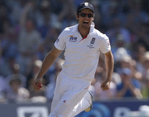 England's Alastair Cook celebrates catching the wicket of Australia's Michael Clarke during day 4 of the second Ashes Test at Lord's cricket ground in London, Sunday, July 21, 2013. (AP Photo