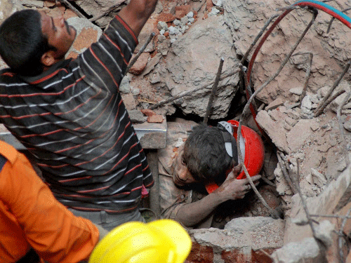 Secunderabad: Rescue workers trying to save an injured after a hotel collapsed in Secunderabad in Andhra Pradesh. PTI file photo