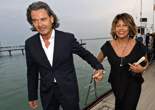 File picture shows singer Tina Turner and her long-term German partner Erwin Bach (L) as they arrive for the premiere of Giacomo Puccini's 'Tosca' at Lake Constance in Bregenz, July 19, 2007. Veteran pop star Tina Turner has married her long-time partner in a civil ceremony, ahead of a celebration at their home on the banks of Lake Zurich on July 21, 2013 to mark the union. The 73-year-old 'Simply the Best' singer tied the knot with German-born record producer Erwin Bach at the registry office in the quiet Kuesnacht suburb of Zurich where they live, a municipal official said on July 17, 2013. Picture taken July 19, 2007. REUTERS