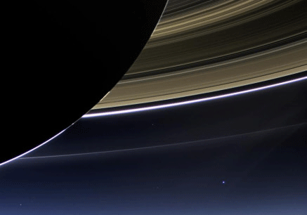 This July 19, 2013 image from the Cassini spacecraft provided NASA shows the planet Earth, bright dot at center right, below Saturn's rings. The image is only one footprint in a mosaic of 33 footprints covering the entire Saturn ring system, including Saturn itself. At each footprint, images were taken in different spectral filters for a total of 323 images: some were taken for scientific purposes and some to produce a natural color mosaic. This is the only wide-angle footprint that has the Earth-moon system in it. AP photo