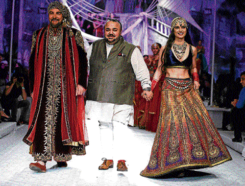 couture Kabir Bedi (L) and Kangna Ranaut (R) walks the ramp for designer JJ Valaya on the first day.