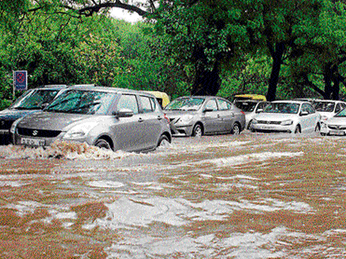 submerged&#8200;Insurance companies are refusing money for damaged cars. DH Photos by pradeep kumar