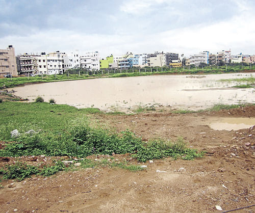 KR Puram lake is being lost to unabated encroachment and increasing constructional activities. Dh photo