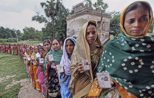 File image: Women wait in a long queue to cast their votes at a polling station. PTI Photo