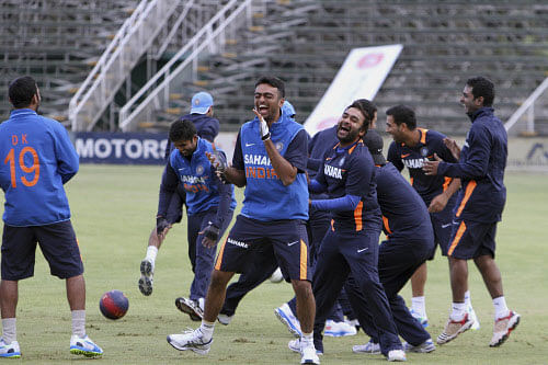 Indian Cricket players play football during a practice session in Harare, Monday, July, 22, 2013. India is in Zimbabwe for one day cricket games. (AP Photo