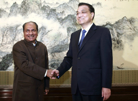 China's Premier Li shakes hands with India's Defence Minister Antony during a meeting in Beijing. Reuters file photo