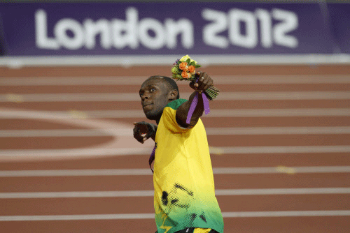 File photograph shows Jamaica's Usain Bolt celebrating with his gold medal during the presentation ceremony for the men's 200m event at the London 2012 Olympic Games at the Olympic Stadium. Reuters
