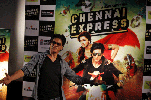 Bollywood star Shahrukh Khan gestures during a press conference to promote his upcoming movie "Chennai Express" in Ahmadabad, India, Friday, July 26, 2013. The movie will be released on August 9, 2013. AP photo