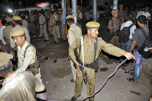 Security personnel cordon off an area after a grenade blast near Paltan Bazar in Guwahati on Sunday. PTI Photo