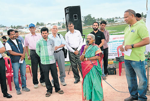 green sense: Saalumarada Thimmakka speaks during an event organised to plant saplings at the Yelahanka lake  recently. dh photo
