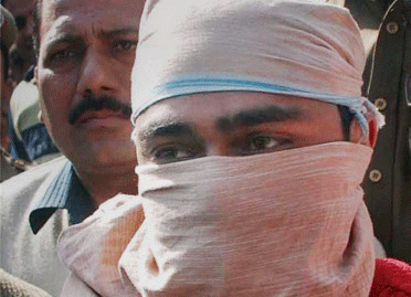 **FILE** Indian Mujahideen (IM) terrorist Shahzad Ahmed is produced in a court in New Delhi in Feb 2010. A Delhi court on Thursday convicted Shahzad Ahmed in 2008 Batla House encounter case. PTI Photo