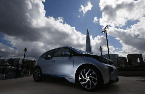 The new BMW i3 electric car is seen, with the Shard building at rear, after it was unveiled at a ceremony in London, July 29, 2013. REUTERS