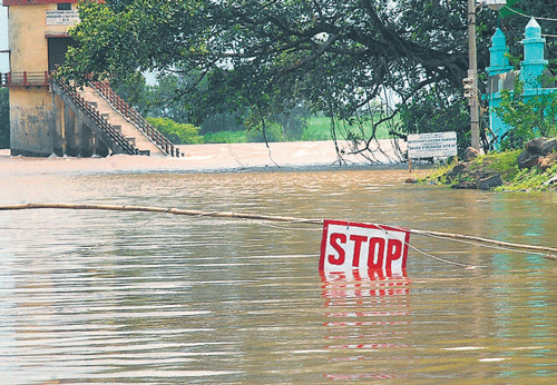 Kudachi bridge in Raibag taluk, Belgaum district, continued to be submerged in the Krishna river water. DH Photo