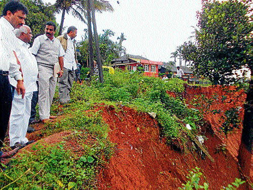 MP H Vishwanath inspects rain-affected areas in Somwarpet on Monday.