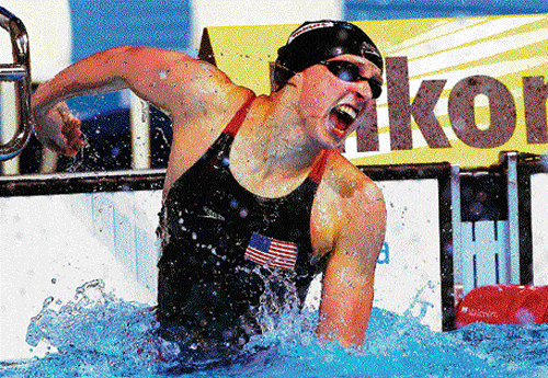 Ecstatic: American Katie Ledecky celebrates after winning the women's 400M freestyle gold at the World Swimming Championships in Barcelona on Sunday. afp