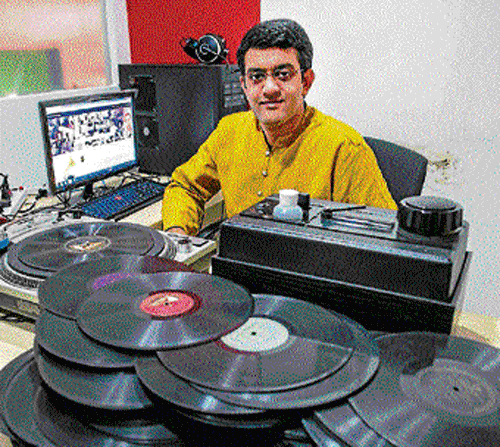 Vikram Sampath with his records.