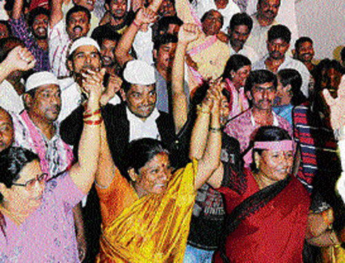 TRS party workers celebrate in Hyderabad on Tuesday. PTI