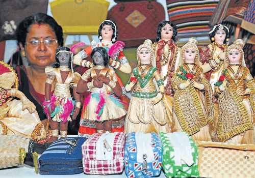 all  jute: Jute dolls are on display at one of the stalls at Jute fair at Hotel Woodlands in Mangalore on Wednesday. (Right) Accessories are displayed. (Below left) Artistically created flex board using jute, which has been placed near the entrance of Jute fair. (Below right)  Some of the jute items for sale at the exhibition. dh photos