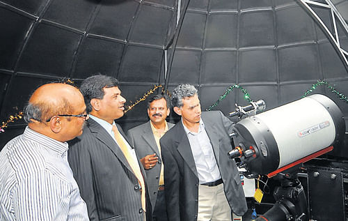 P Sreekumar, Director, Indian Institute of Astrophysics inaugurates the new telescope at Department of Studies in Physics, University of Mysore, in Mysore, on Thursday. K Byrappa, Director, UPE Project,  Astro Creations and Impex Pvt Ltd  K S Rangappa, Vice-Chancellor, University of Mysore, Shalien Aggrahari, Managing Director, are seen. dh photo