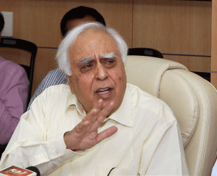 Union Minister for Communication and Information Technology, Kapil Sibal, speaks to media during the launch of 'e- Gov Appstore' in New Delhi on Friday. PTI Photo